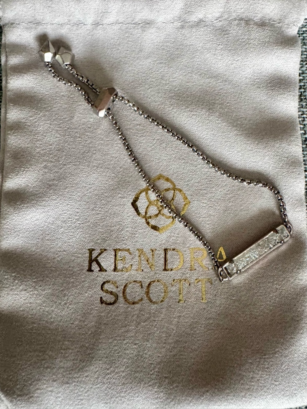 Kendra Scott Silver Bar Slider Bracelet features an iridescent quartz